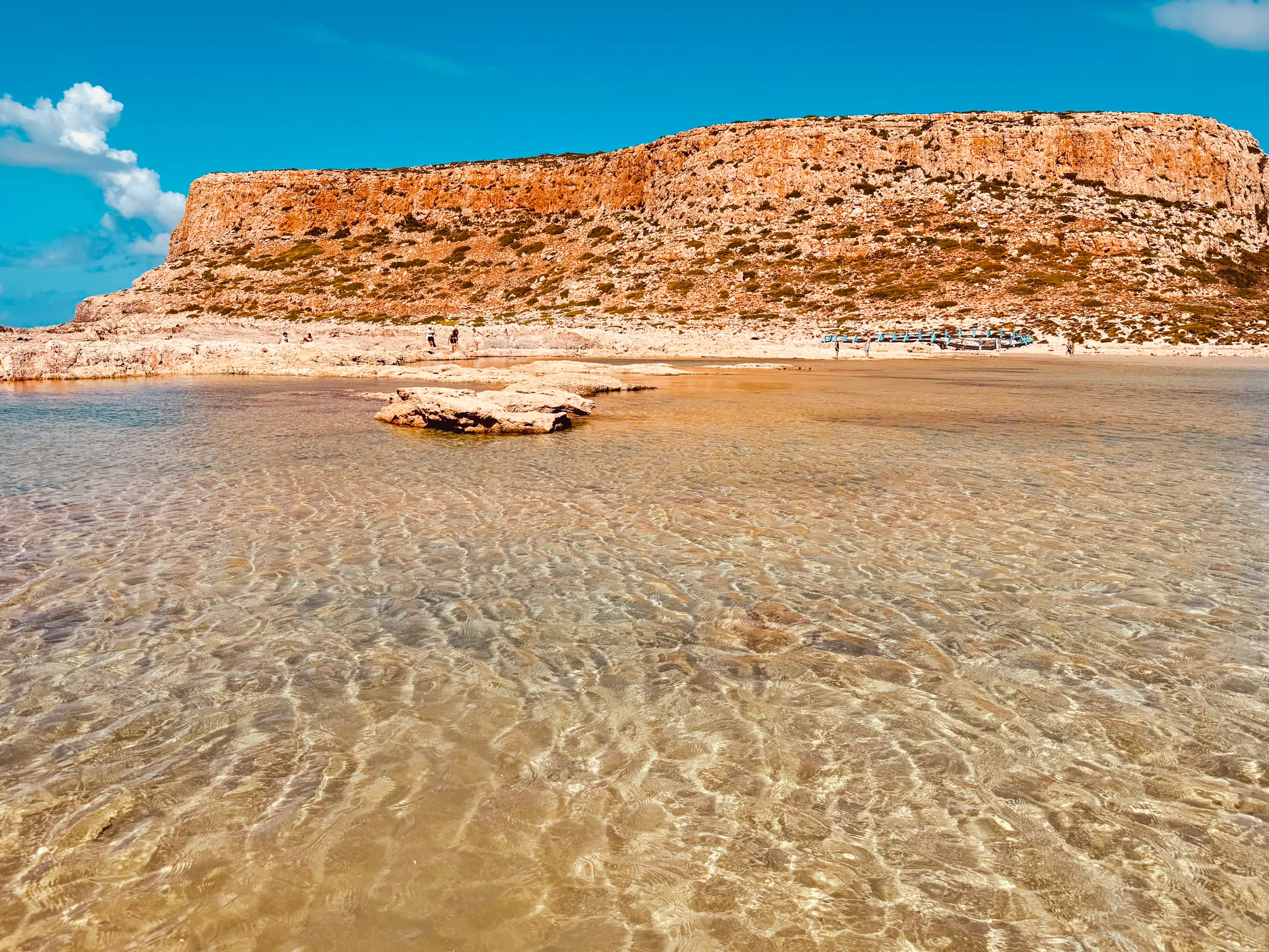 Balos lagoon, Crete, clear shallow water and the orange cliffs of Cape Tigani